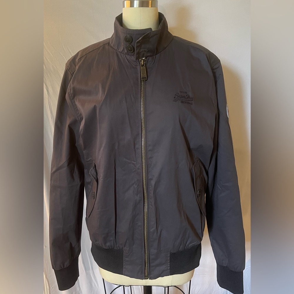 Superdry. Men’s large but fits a medium. Gray zip jacket.